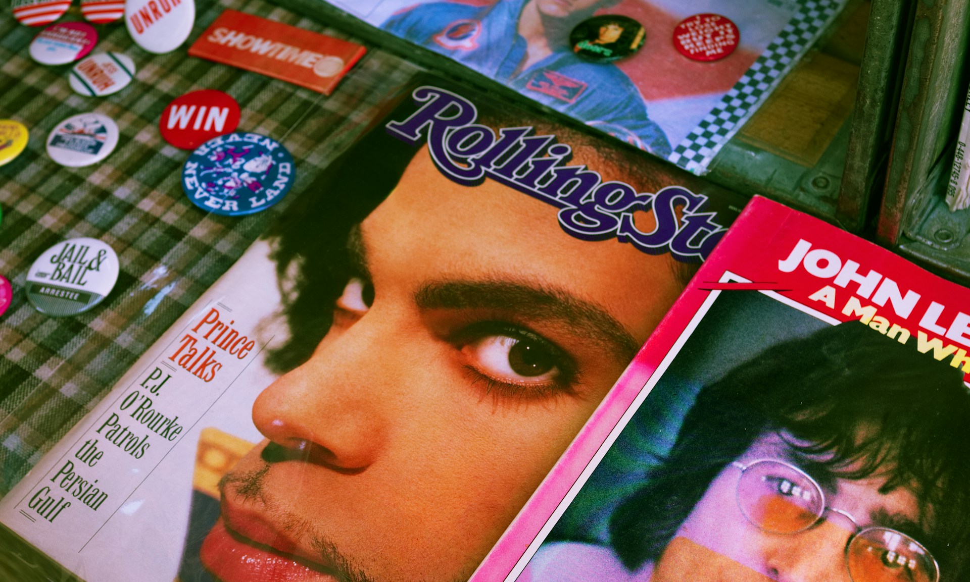 Several magazine covers including Prince on Rolling Stone and John Lennon on another